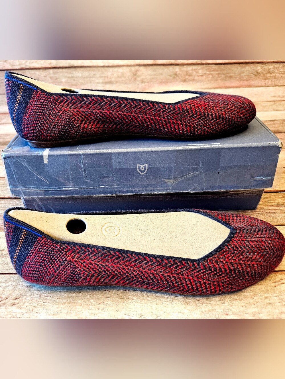 Rothy's "The Flat" shoes in a red and navy blue merino wool